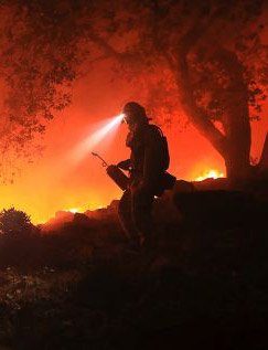 A firefighter monitors a flare up in Sonoma, California. Photo: AP
